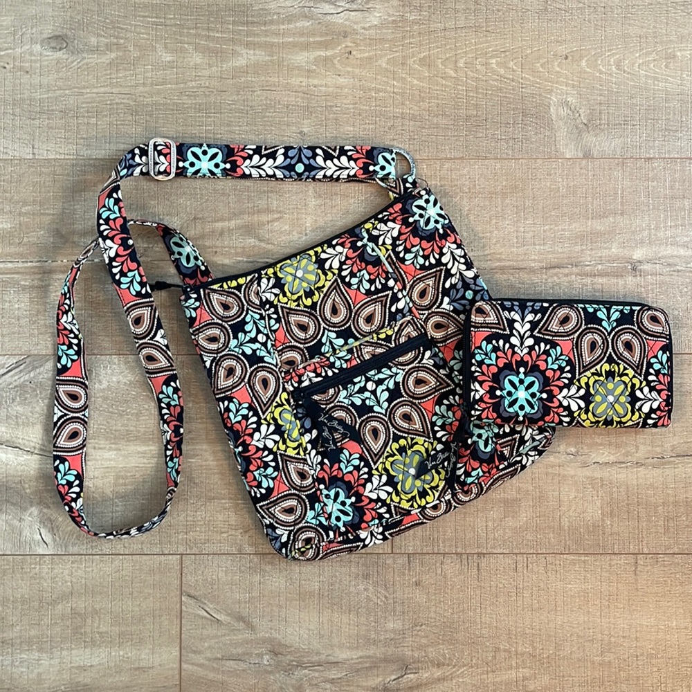 Gently used Vera Bradley cross body purse and matching zip around wallet.